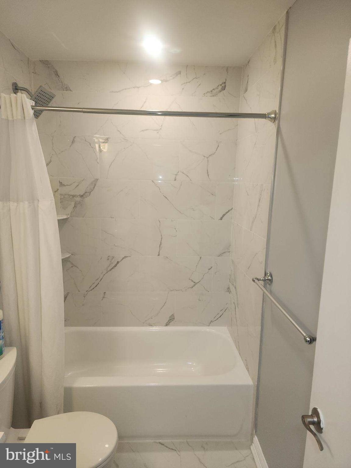 2218 Strahle Street Philadelphia, PA 19152 - Photo 19 of 22 a bathroom with a shower a toilet and a shower