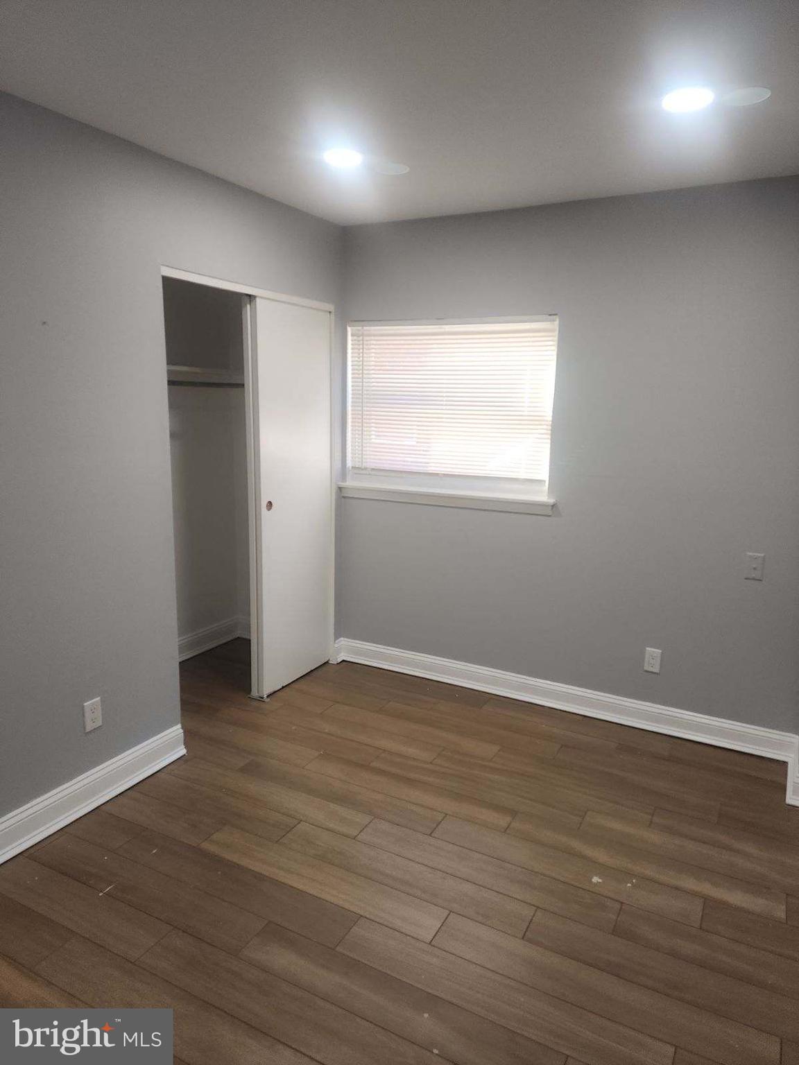 2218 Strahle Street Philadelphia, PA 19152 - Photo 9 of 22 an empty room with wooden floor and windows