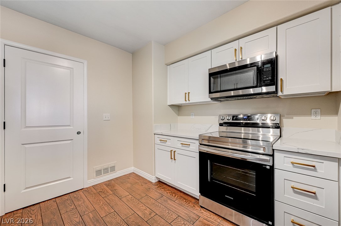 7255 West Sunset Road, Unit 2005 Las Vegas, NV 89113 - Photo 17 of 27 Streamlined kitchen boasts contemporary cabinetry, gleaming countertops, and integrated stainless steel appliances.