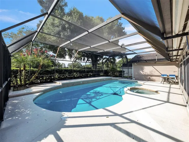 a view of a brick house with many windows