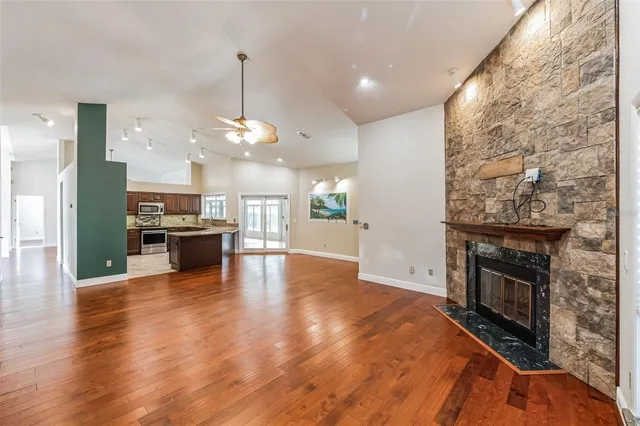 a view of a kitchen with a stove cabinets and wooden floor