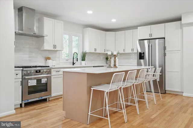 a bathroom with a sink a mirror and shower