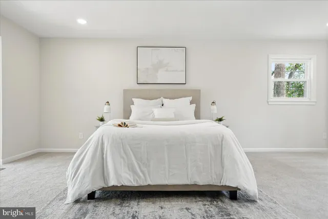 a bed room with a bed window and a table