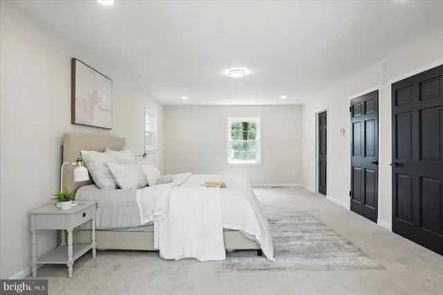 a white bath tub sitting next to a shower