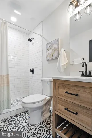 a view of a hallway with wooden floor and closet