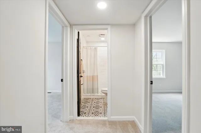 a bathroom with a bathtub a shower sink vanity and a mirror