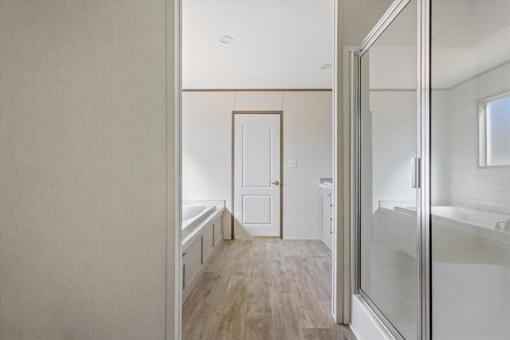 201 North Carpenter Street Mart, TX 76664 - Photo 15 of 30 a view of a hallway with wooden floor