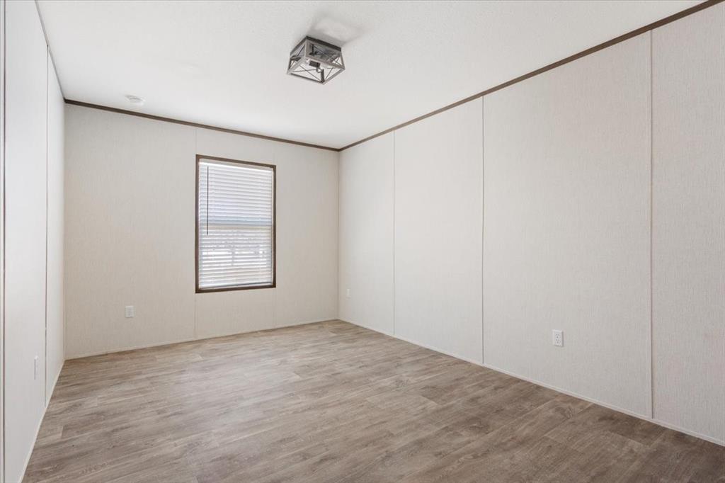 201 North Carpenter Street Mart, TX 76664 - Photo 20 of 30 an empty room with a empty space and windows