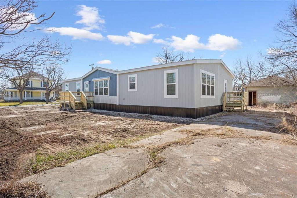 201 North Carpenter Street Mart, TX 76664 - Photo 27 of 30 a front view of a house with a yard