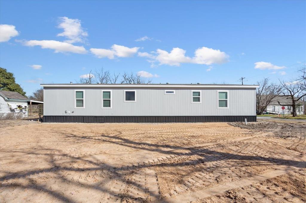 201 North Carpenter Street Mart, TX 76664 - Photo 29 of 30 a view of a house with a yard