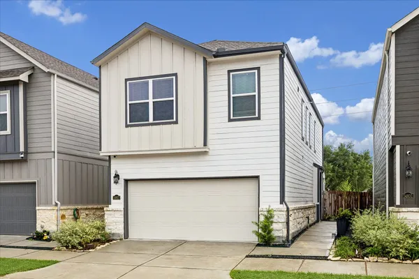 a front view of a house with garage