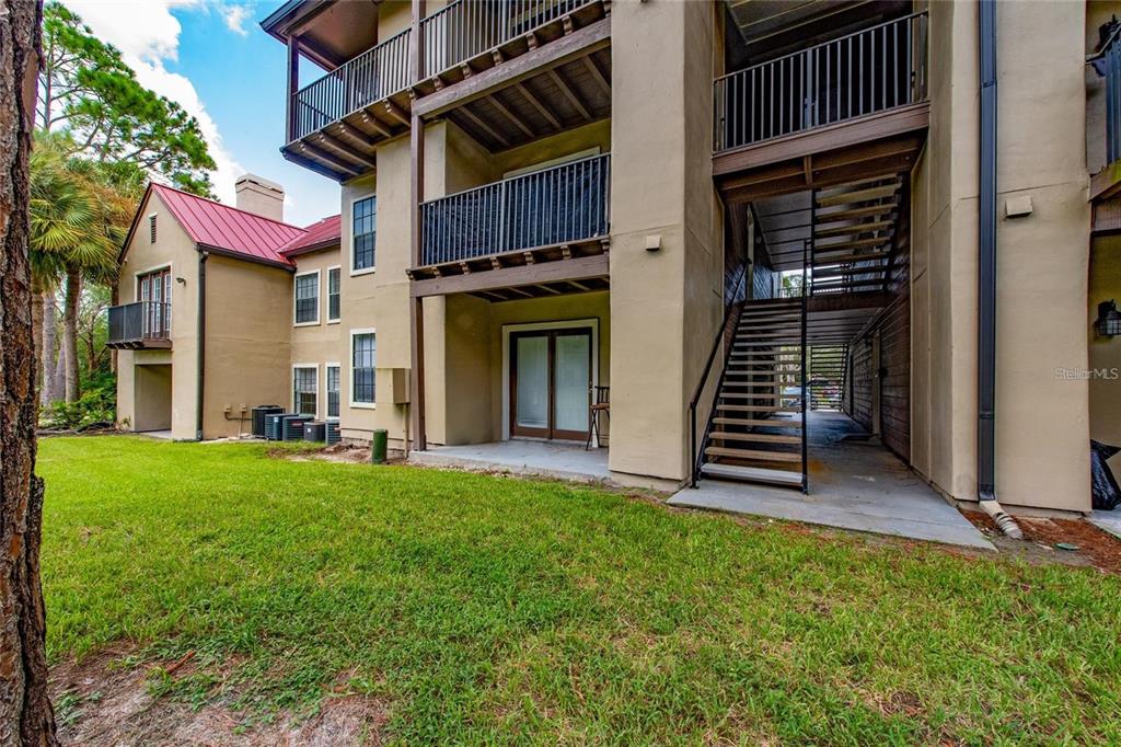 232 Afton Square, Unit 108 Altamonte Springs, FL 32714 - Photo 11 of 26 a view of a house with backyard and porch