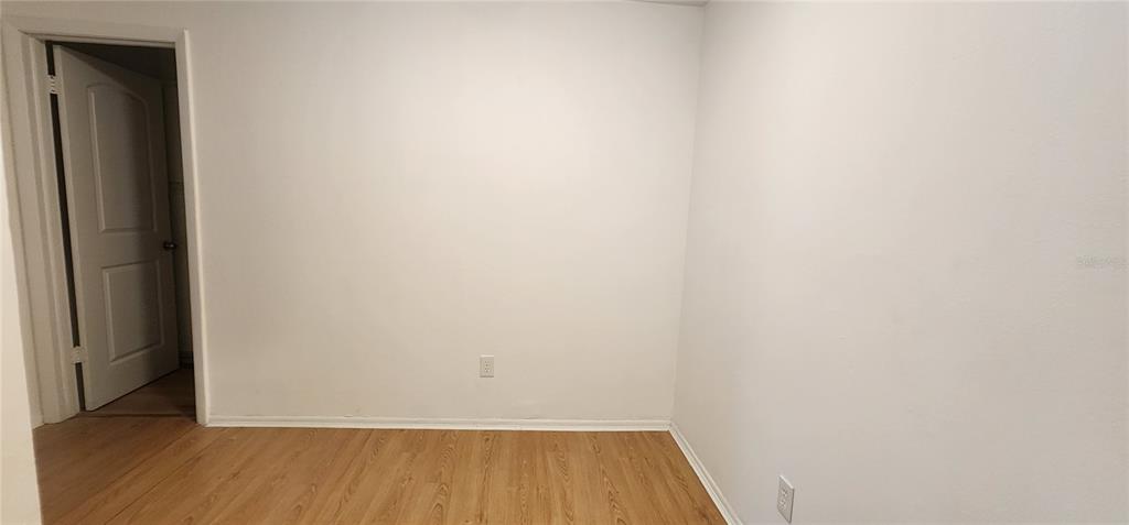 232 Afton Square, Unit 108 Altamonte Springs, FL 32714 - Photo 22 of 26 a view of a small space with wooden floor and a window