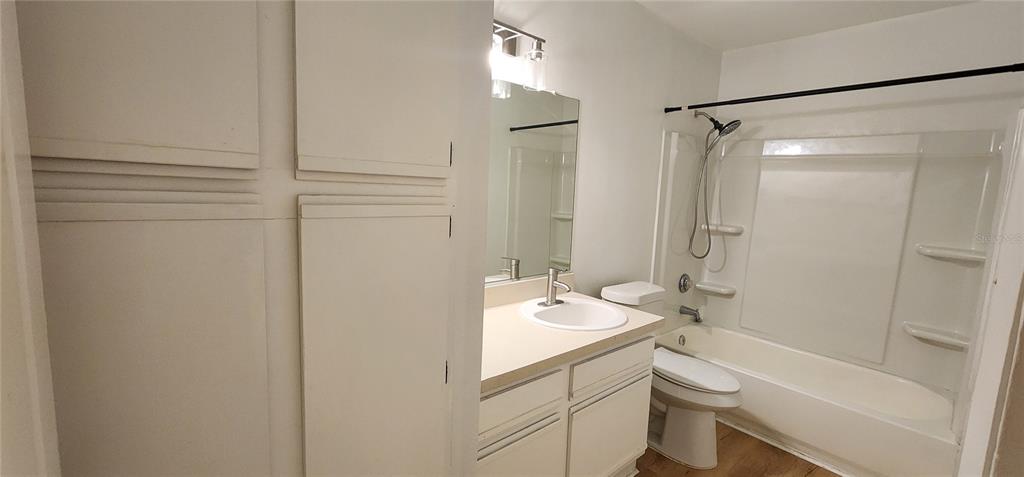 232 Afton Square, Unit 108 Altamonte Springs, FL 32714 - Photo 23 of 26 a bathroom with a granite countertop sink toilet and shower