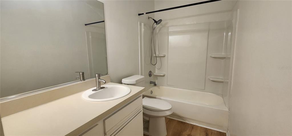 232 Afton Square, Unit 108 Altamonte Springs, FL 32714 - Photo 24 of 26 a bathroom with a sink toilet and shower