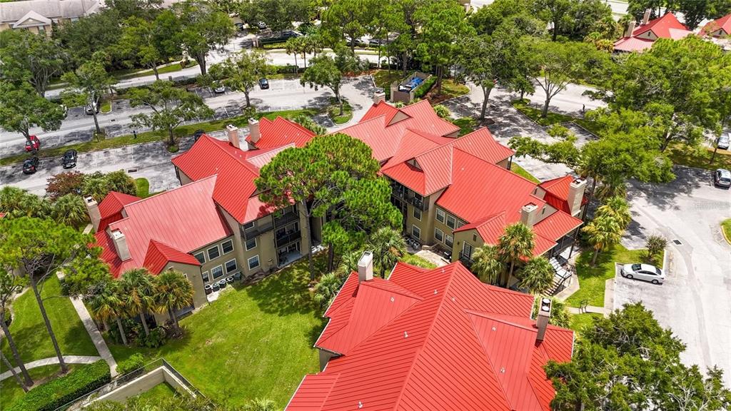 232 Afton Square, Unit 108 Altamonte Springs, FL 32714 - Photo 4 of 26 an aerial view of residential houses with outdoor space and trees