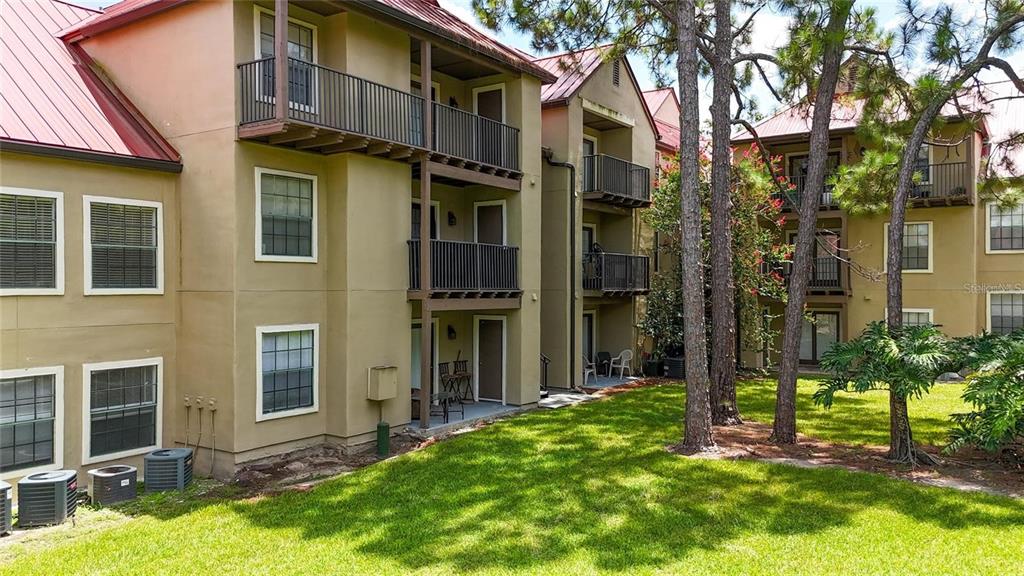 232 Afton Square, Unit 108 Altamonte Springs, FL 32714 - Photo 8 of 26 a view of a building with a yard