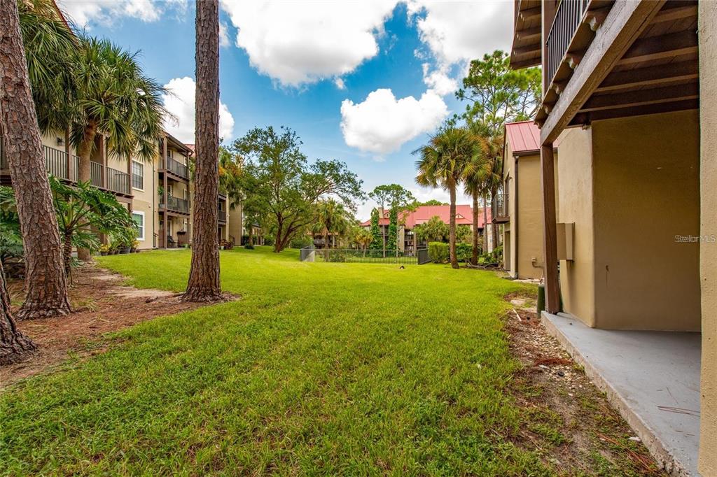 232 Afton Square, Unit 108 Altamonte Springs, FL 32714 - Photo 9 of 26 a view of a yard with plants and trees