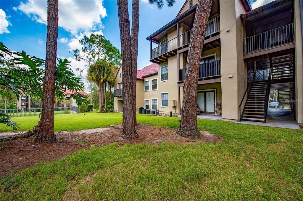 232 Afton Square, Unit 108 Altamonte Springs, FL 32714 - Photo 10 of 26 a house with tree in front of it