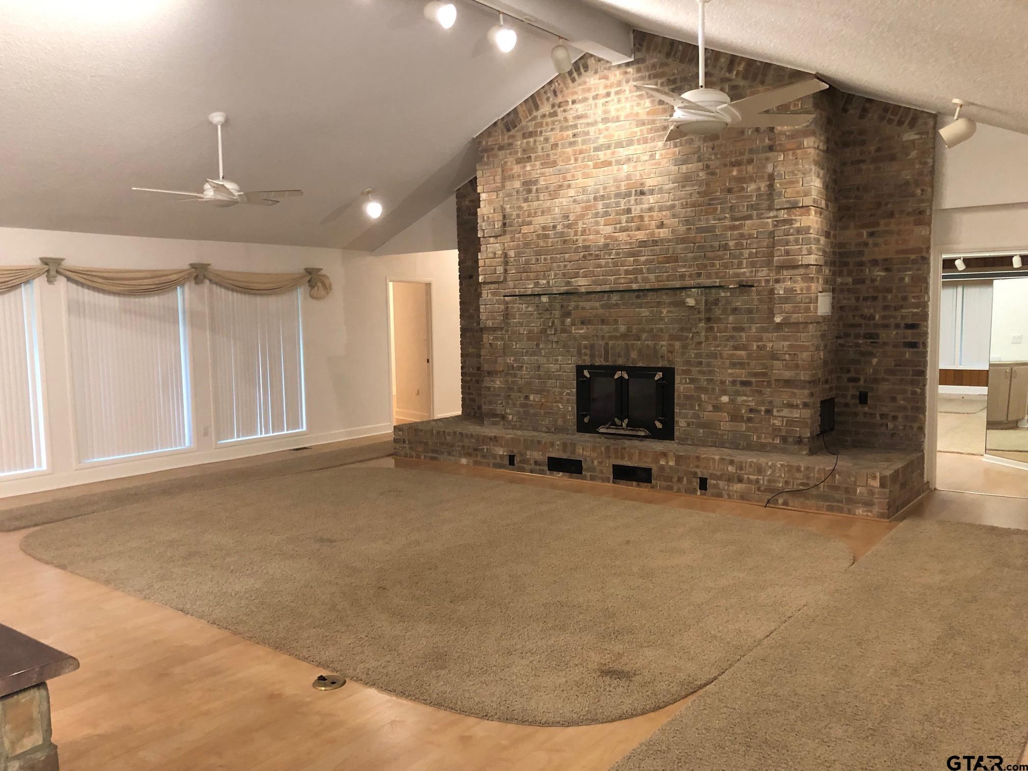 13745 Meadow Lane Flint, TX 75762 - Photo 15 of 38 a view of livingroom with fireplace and window