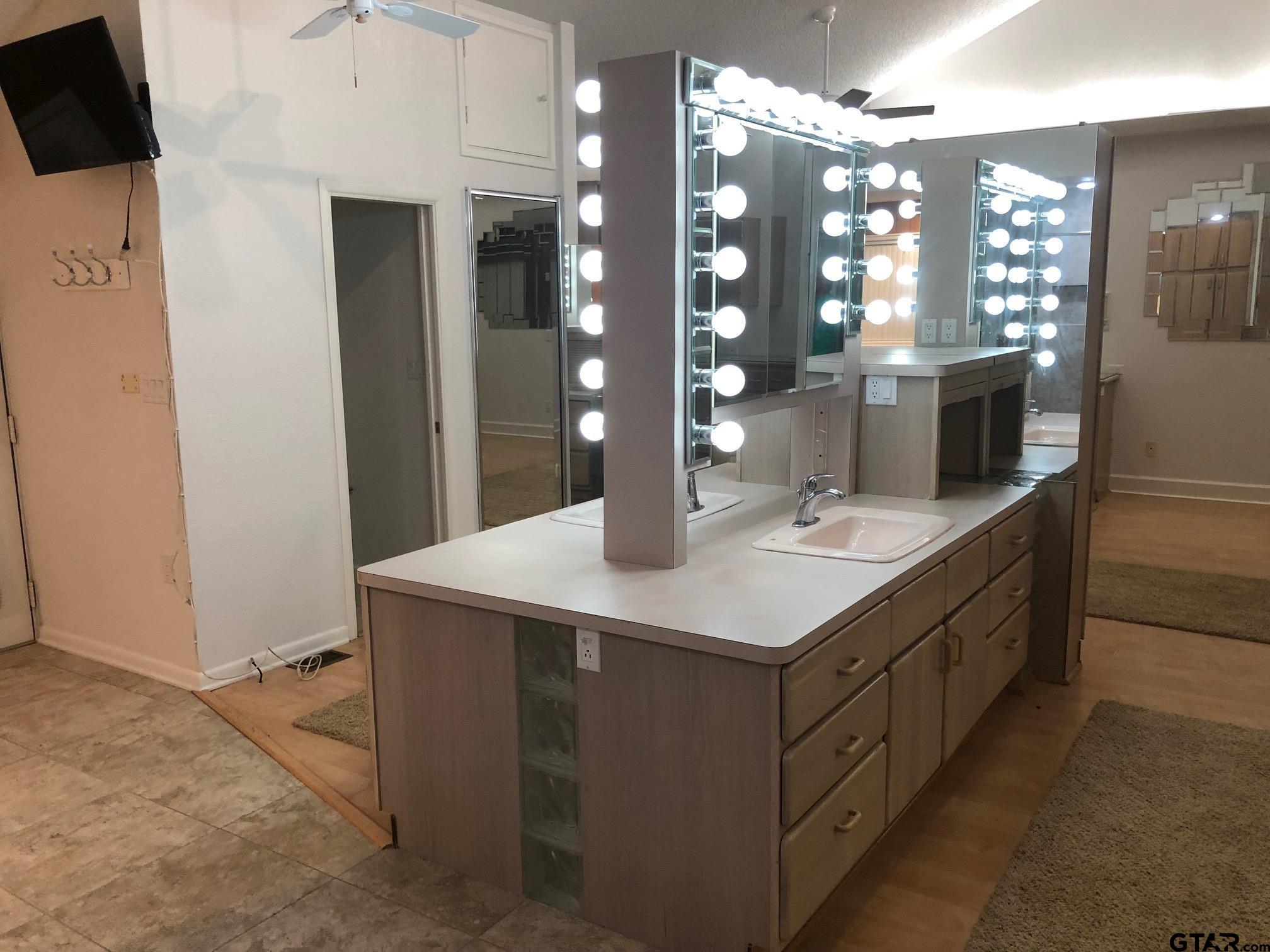 13745 Meadow Lane Flint, TX 75762 - Photo 24 of 38 a bathroom with a sink double vanity and a mirror