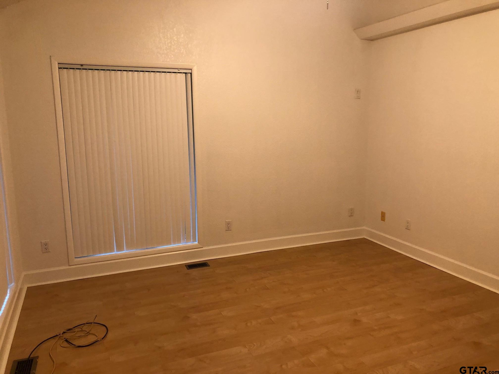 13745 Meadow Lane Flint, TX 75762 - Photo 30 of 38 an empty room with a door