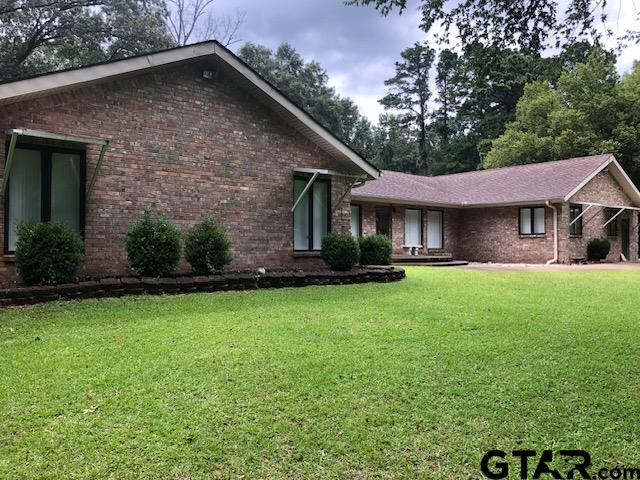 13745 Meadow Lane Flint, TX 75762 - Photo 3 of 38 a front view of a house with a garden