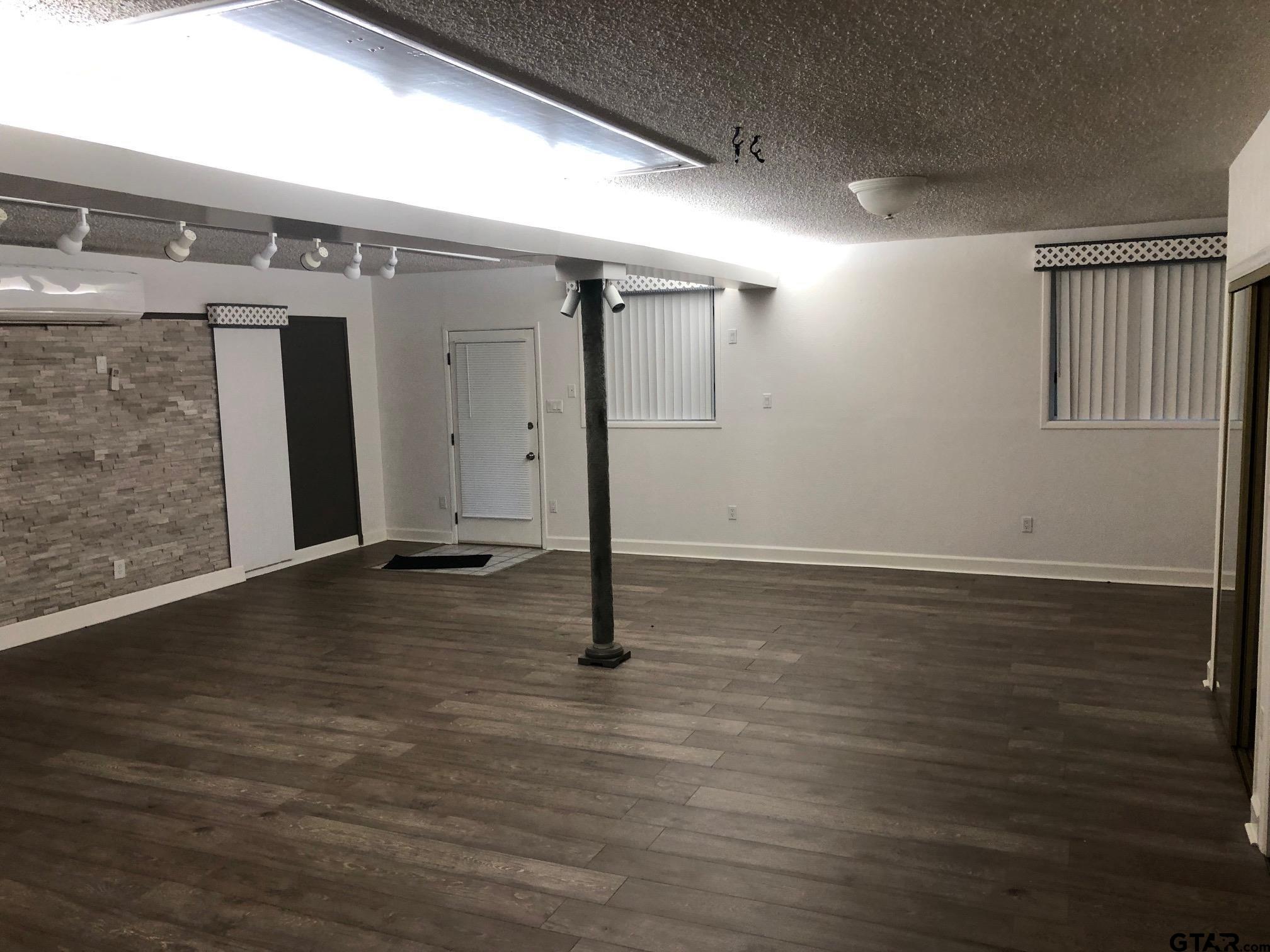 13745 Meadow Lane Flint, TX 75762 - Photo 31 of 38 a view of an empty room with wooden floor