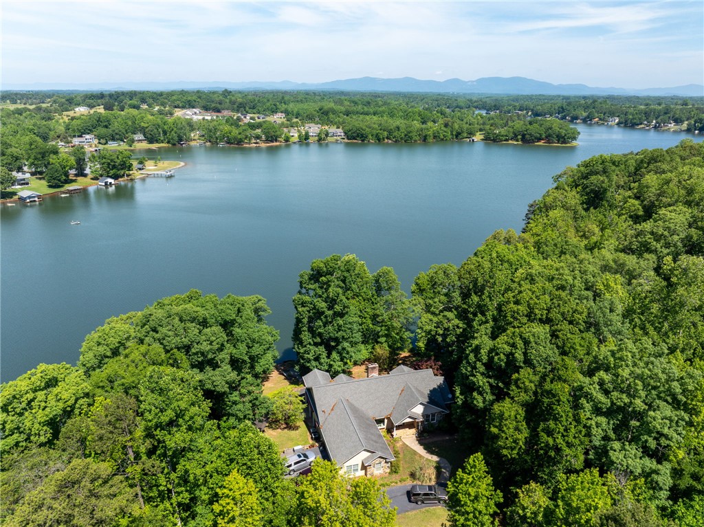 0 Ben Hurt Road Lyman, SC 29365 - Photo 16 of 21 Perched above the lake, this residence offers a captivating waterfront perspective amidst lush, mature trees.