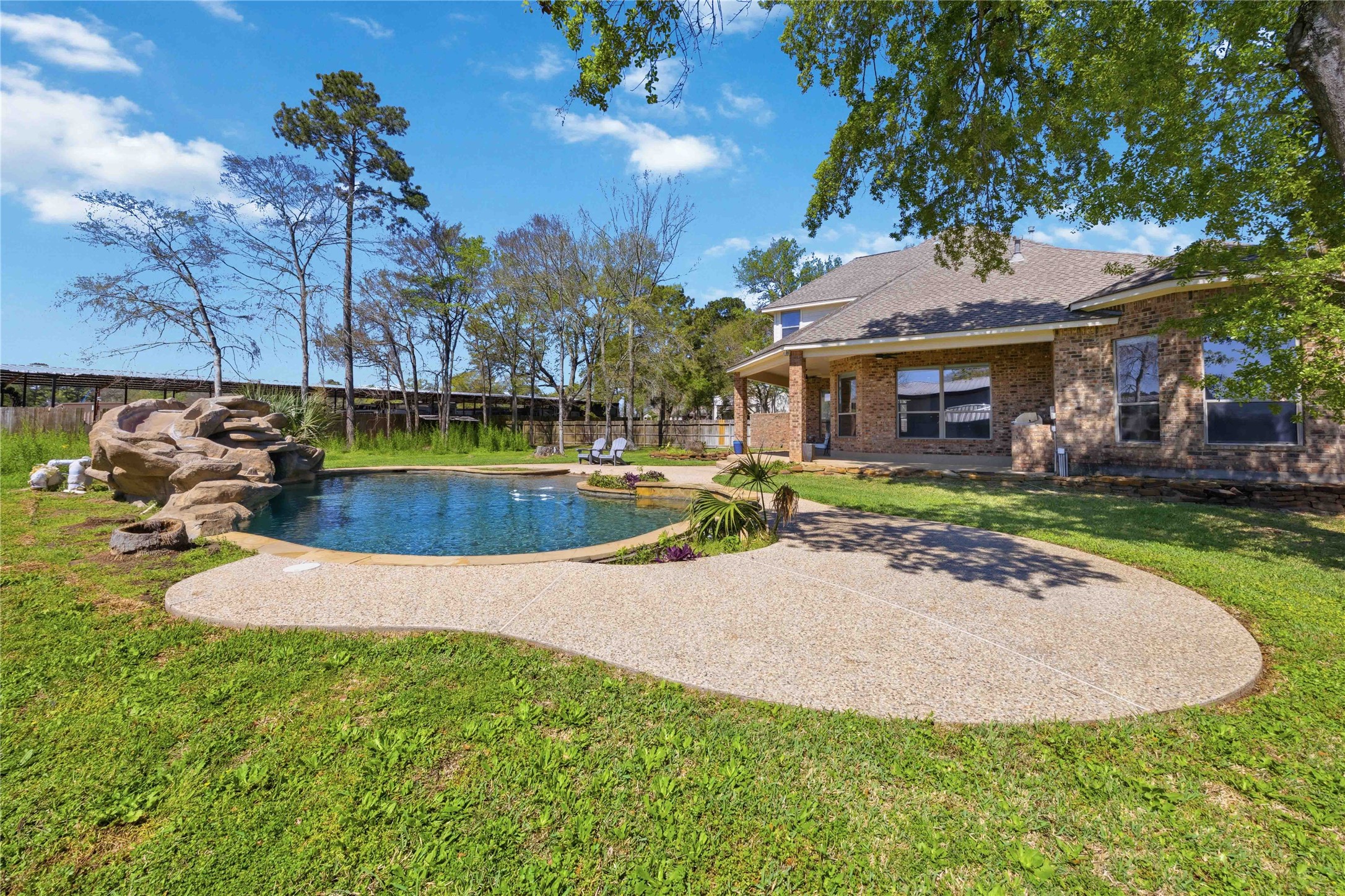 1930 Old River Road Montgomery, TX 77356 - Photo 34 of 49 Whether you want to catch some rays or relax in the shade, this backyard meets those needs.