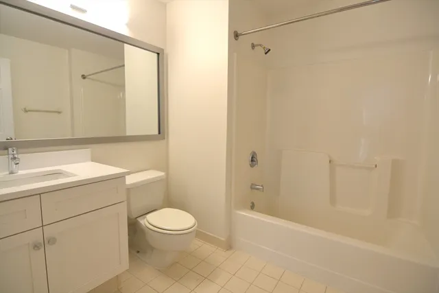 a picture of a bench in front of a gate