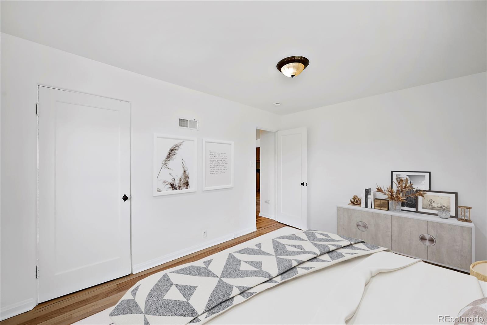 874 9th Street Boulder, CO 80302 - Photo 11 of 23 a bedroom with a bed and a refrigerator