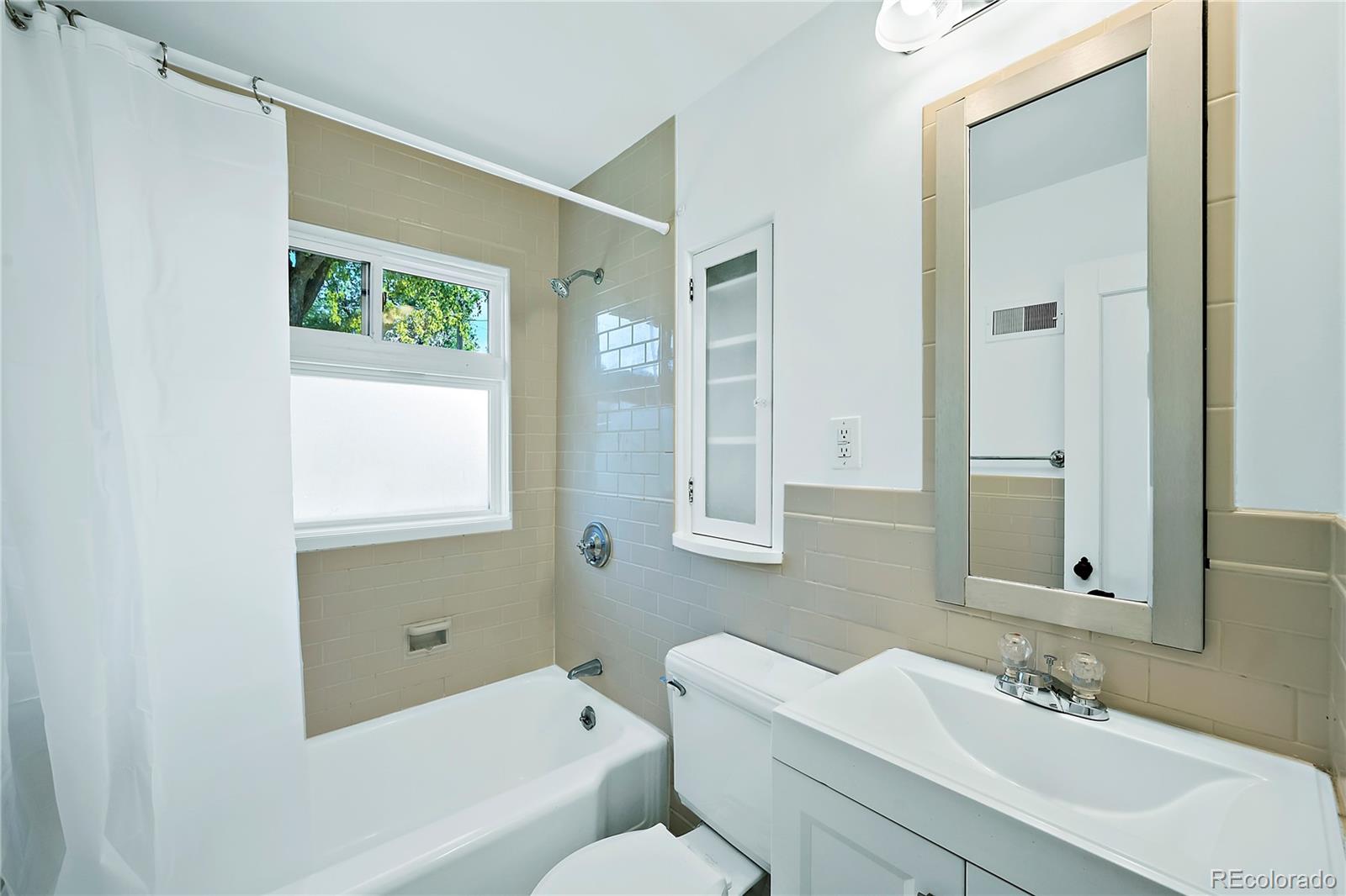 874 9th Street Boulder, CO 80302 - Photo 13 of 23 a bathroom with a sink and a mirror
