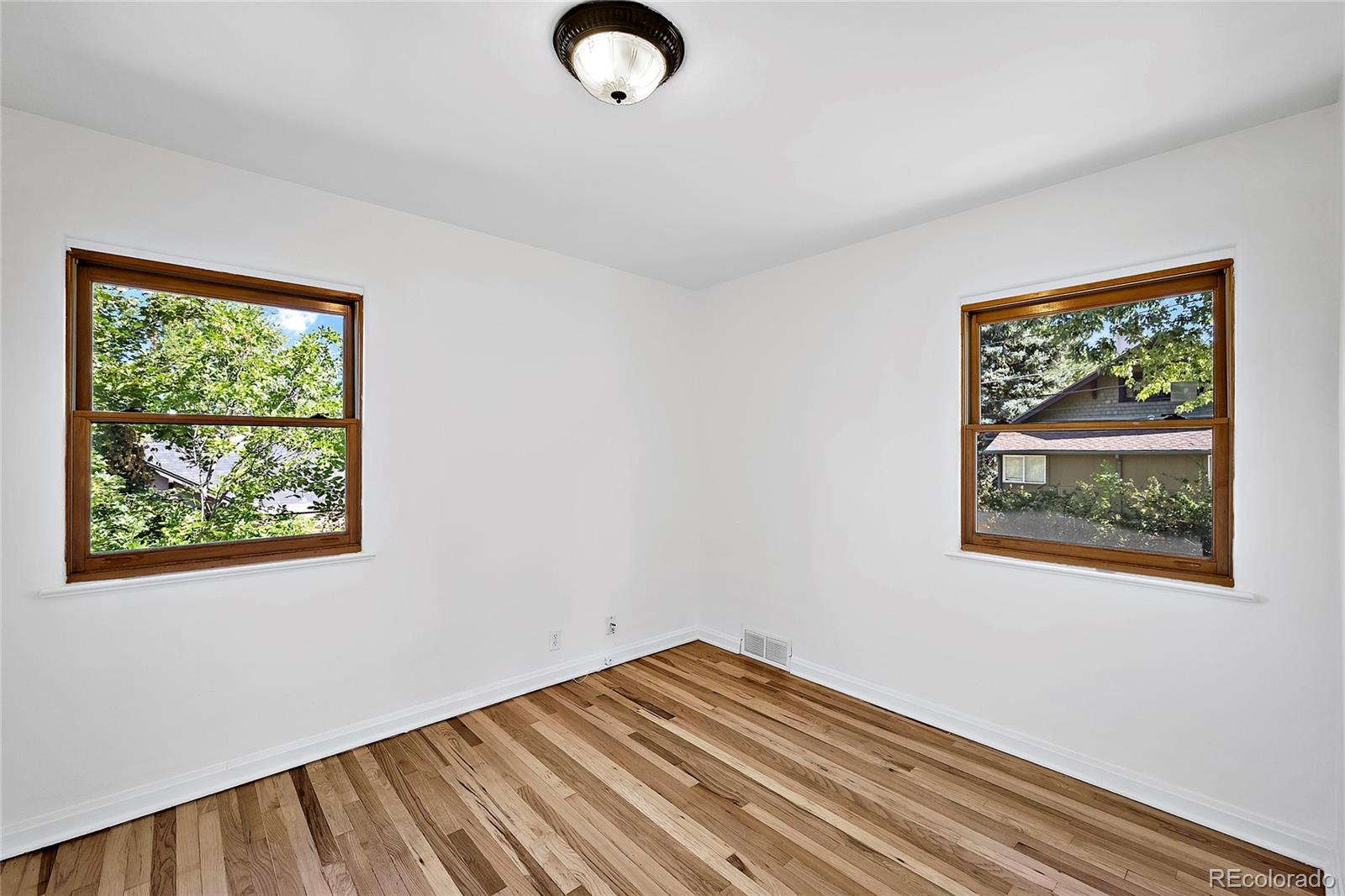 874 9th Street Boulder, CO 80302 - Photo 14 of 23 a view of a room with wooden floor and window