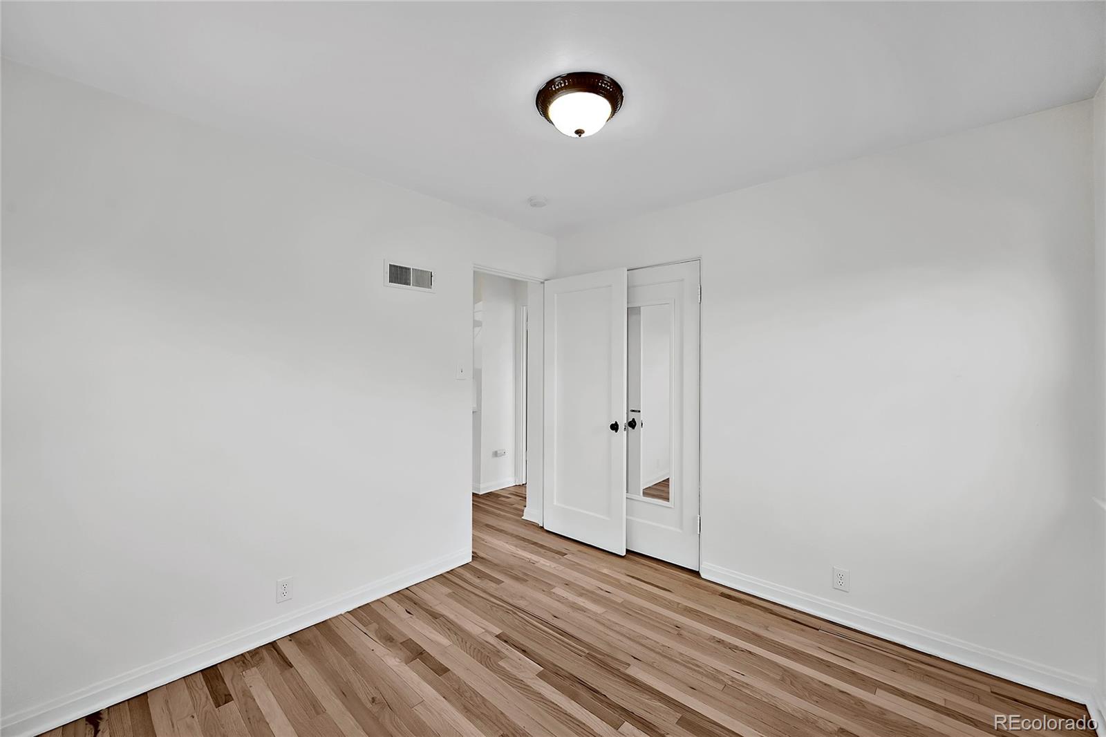 874 9th Street Boulder, CO 80302 - Photo 15 of 23 a view of room with wooden floor