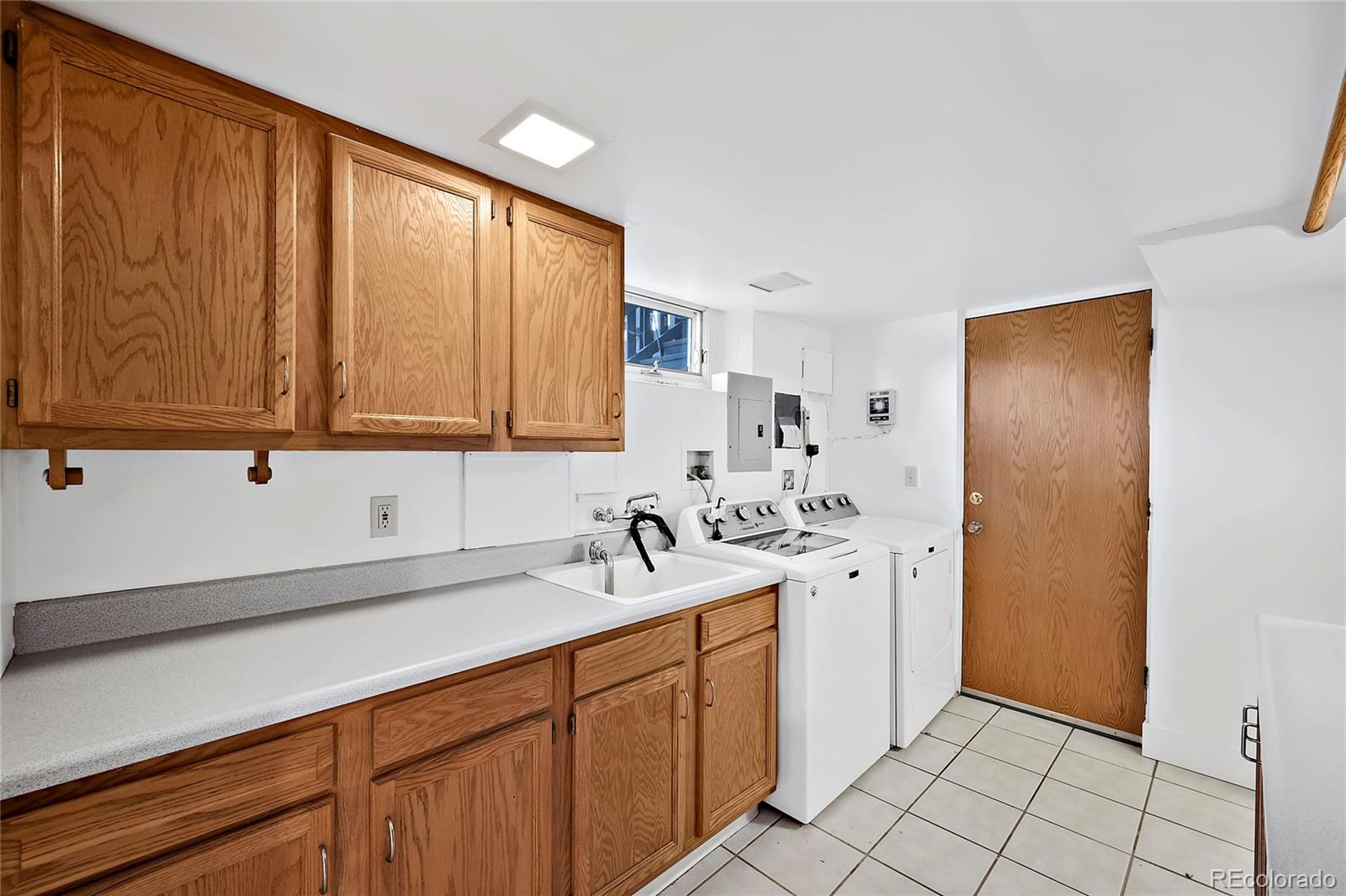 874 9th Street Boulder, CO 80302 - Photo 20 of 23 a kitchen with a sink and cabinets