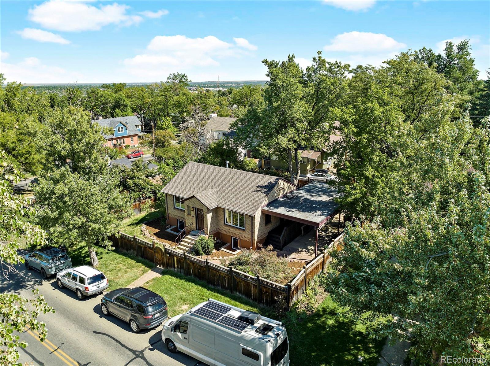 874 9th Street Boulder, CO 80302 - Photo 3 of 23 a view of house with yard outdoor seating and green space