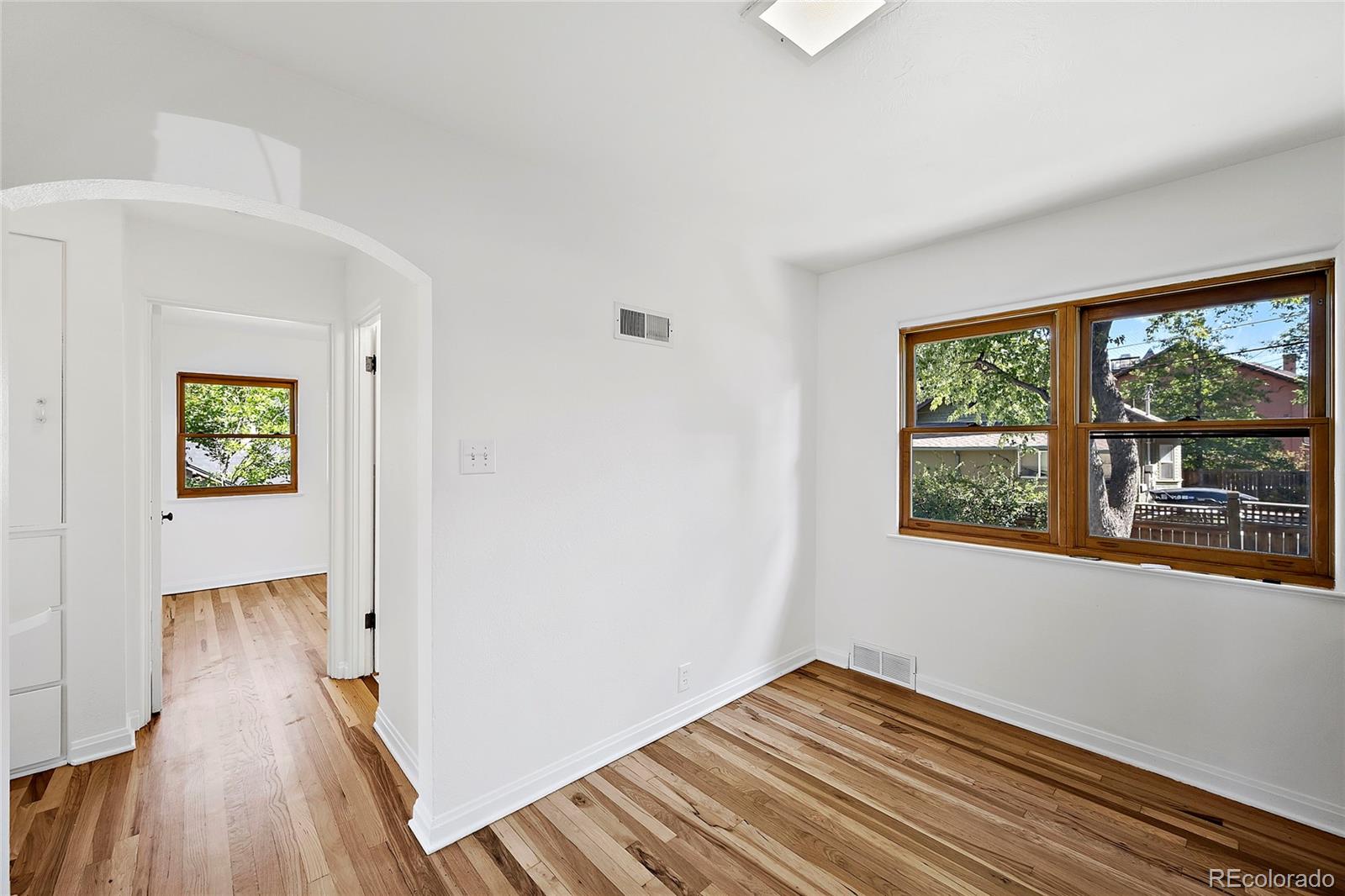 874 9th Street Boulder, CO 80302 - Photo 7 of 23 a view of hallway with window and wooden floor