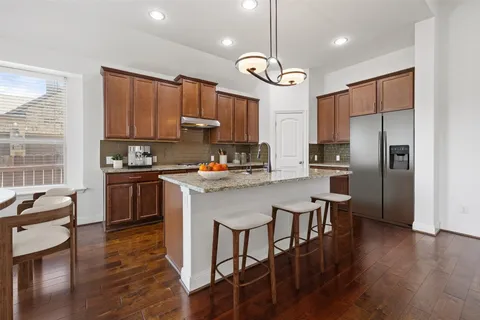 a bedroom with a bed and a potted plant