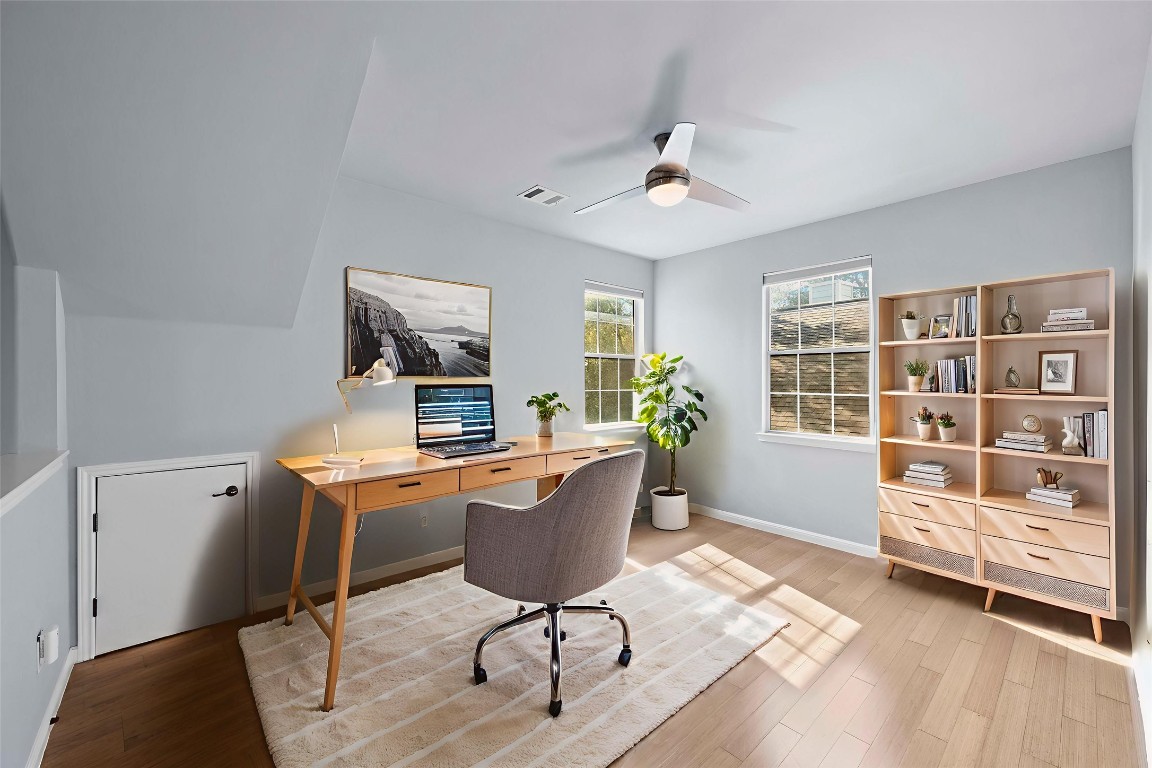 6704 Menchaca Road, Unit 29 Austin, TX 78745 - Photo 20 of 34 a view of a workspace with furniture and a window