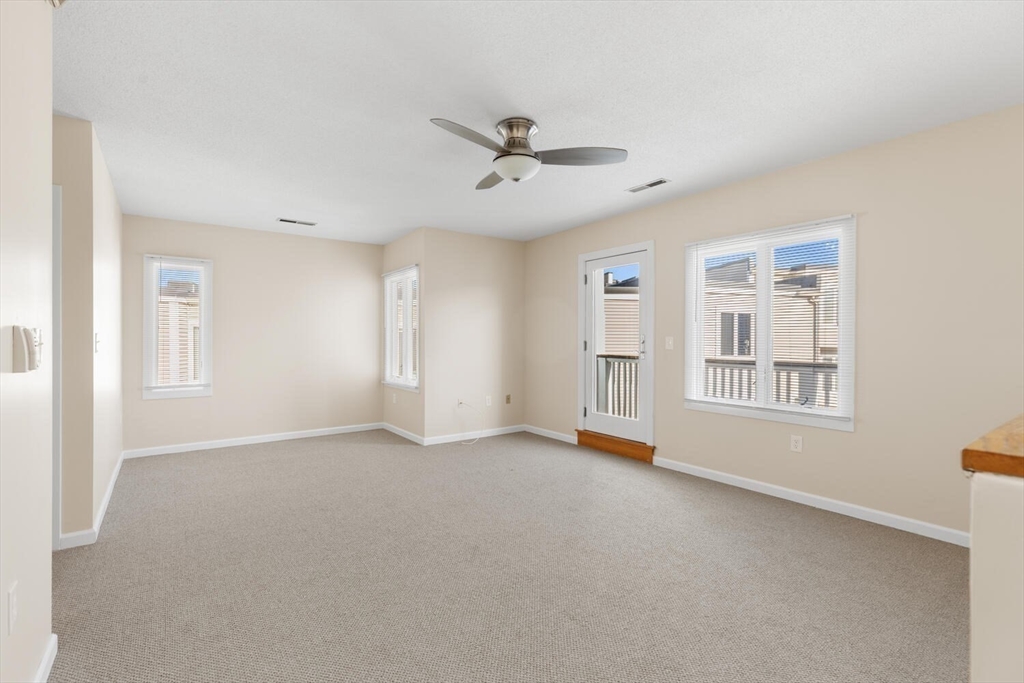 676 Huron Avenue, Unit 43 Cambridge, MA 02138 - Photo 13 of 20 a view of an empty room with a window