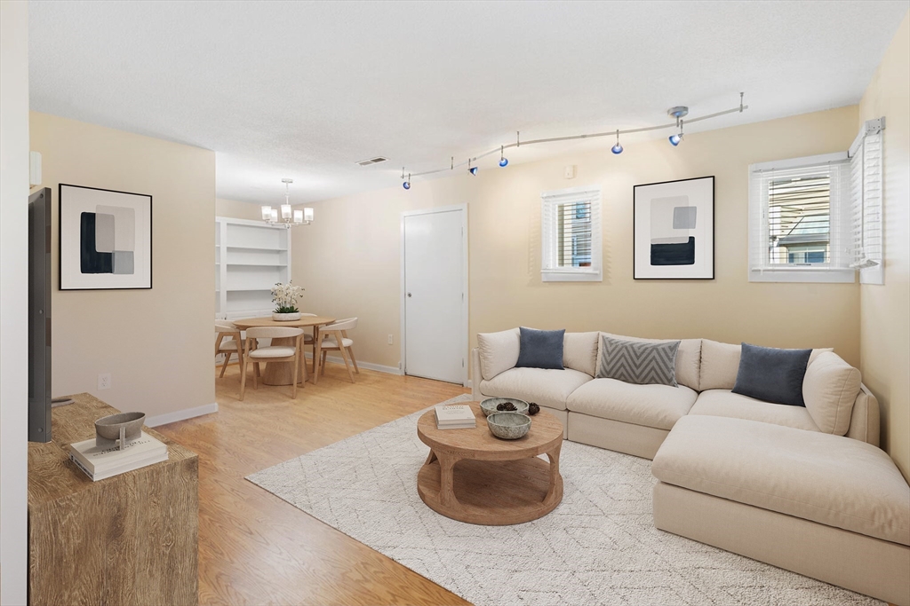 676 Huron Avenue, Unit 43 Cambridge, MA 02138 - Photo 3 of 20 a living room with furniture and a couch