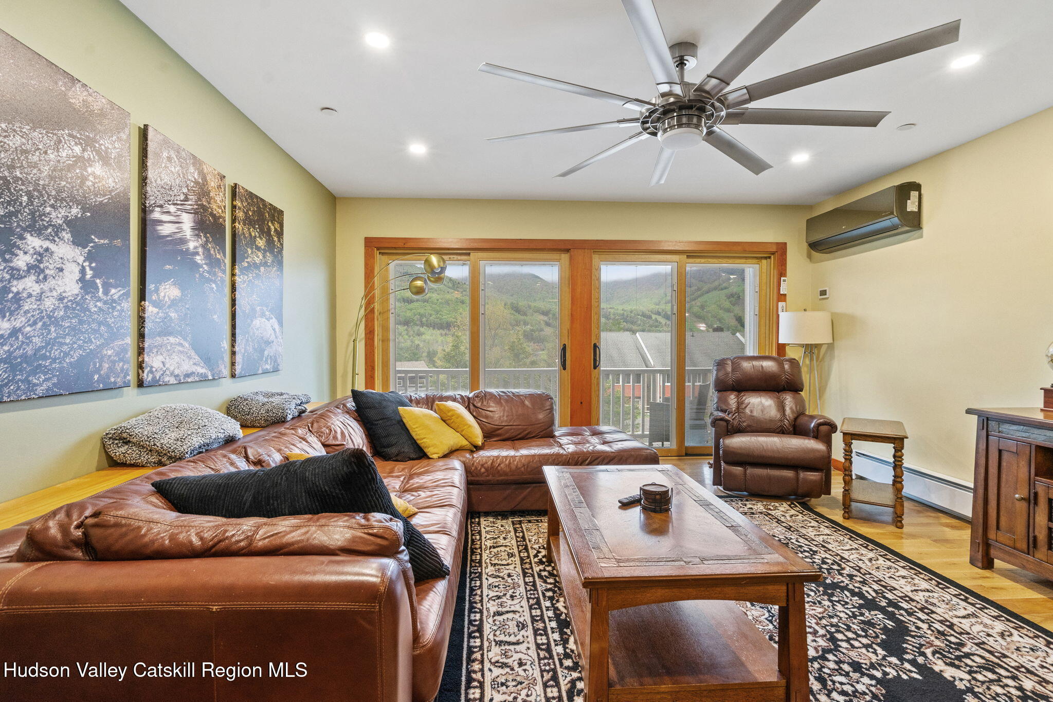 35 Scribner Hollow Road, Unit E3 Hunter, NY 12442 - Photo 14 of 59 a living room with furniture and a large window