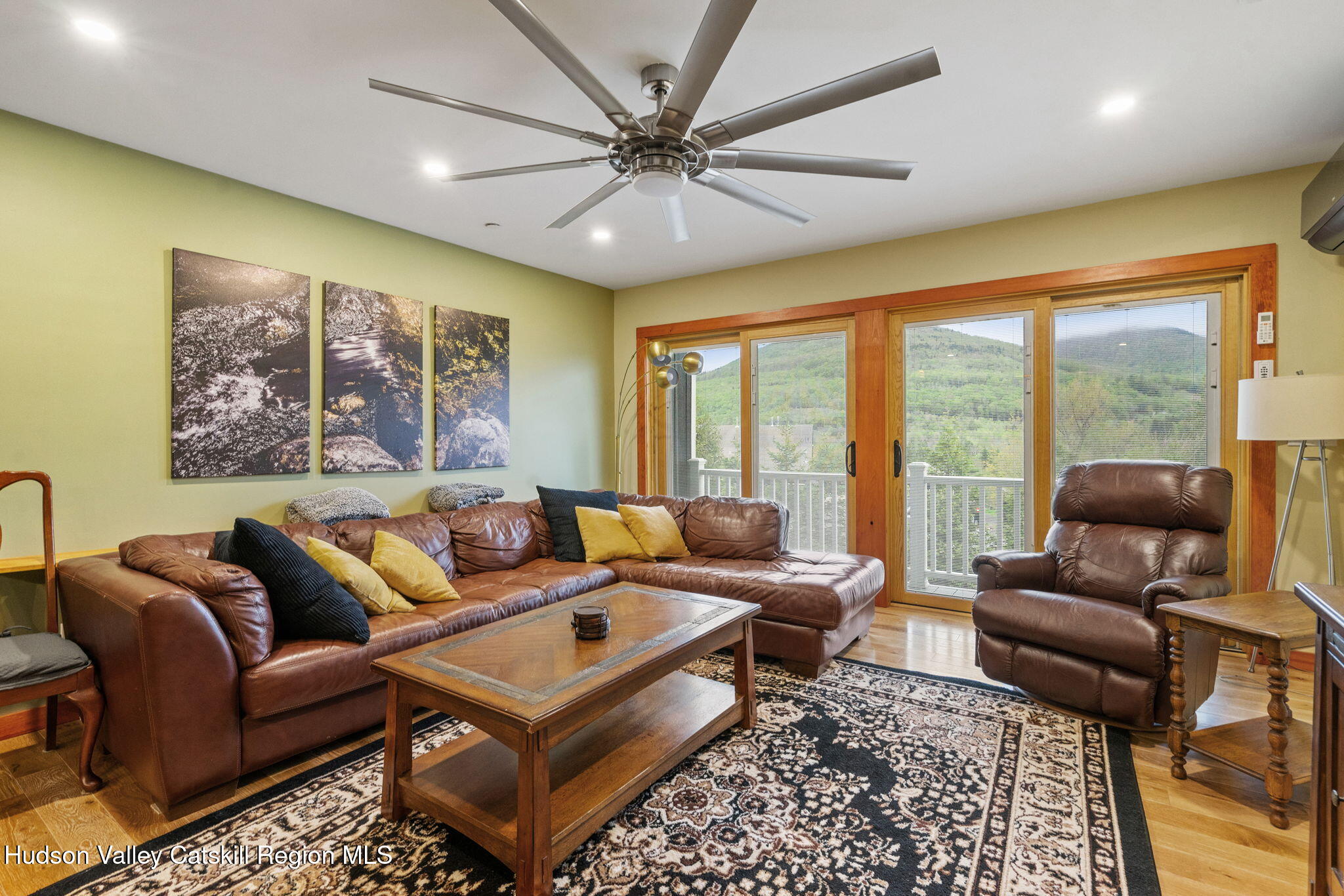 35 Scribner Hollow Road, Unit E3 Hunter, NY 12442 - Photo 15 of 59 a living room with furniture and a large window