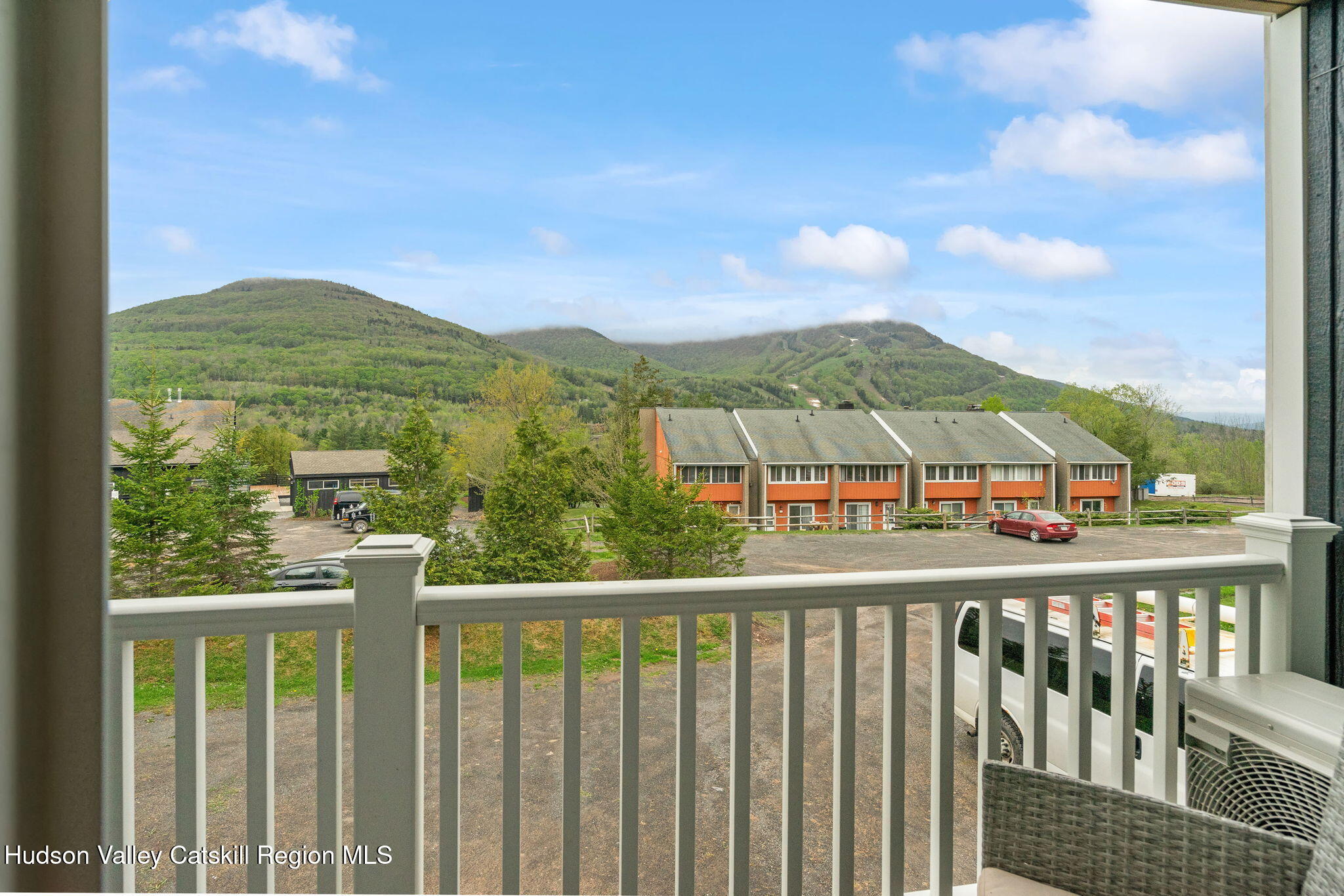 35 Scribner Hollow Road, Unit E3 Hunter, NY 12442 - Photo 18 of 59 a view of a city from a balcony
