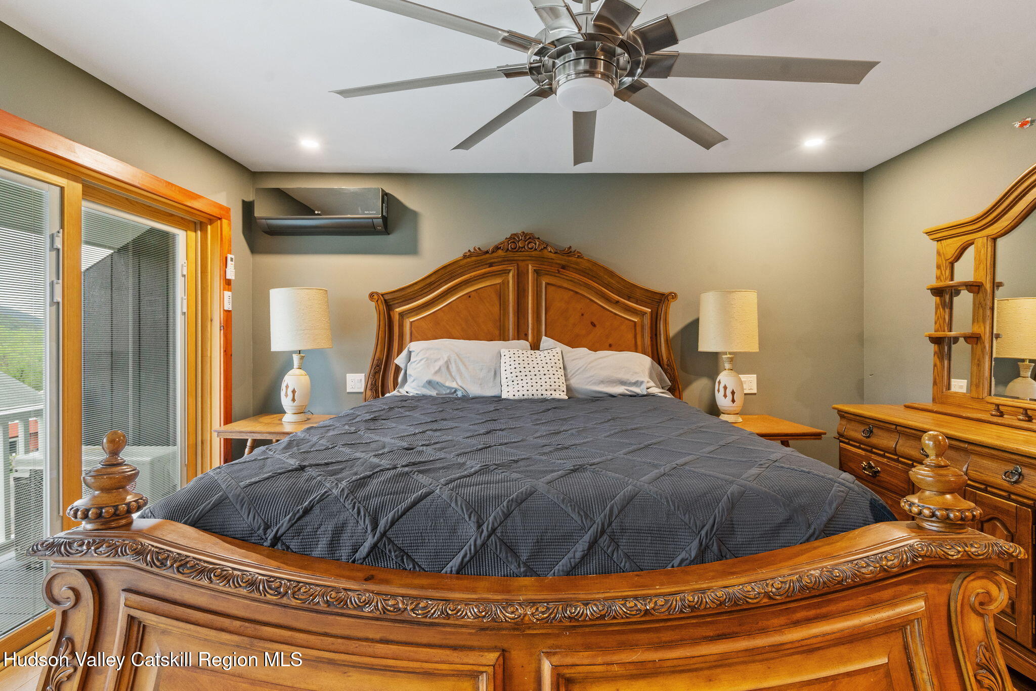 35 Scribner Hollow Road, Unit E3 Hunter, NY 12442 - Photo 25 of 59 a bedroom with a bed and a chandelier