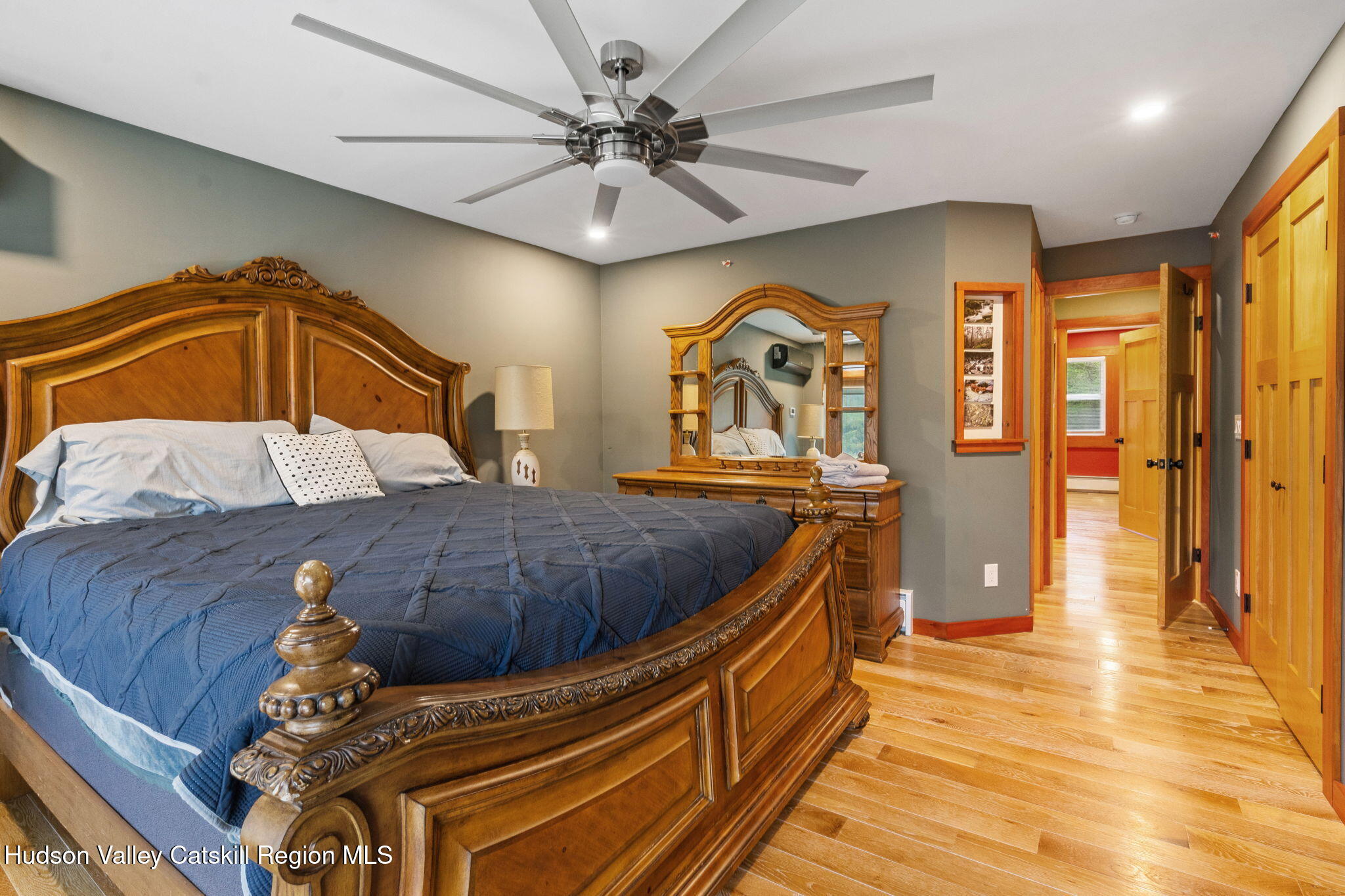 35 Scribner Hollow Road, Unit E3 Hunter, NY 12442 - Photo 27 of 59 a bedroom with a bed and a chandelier