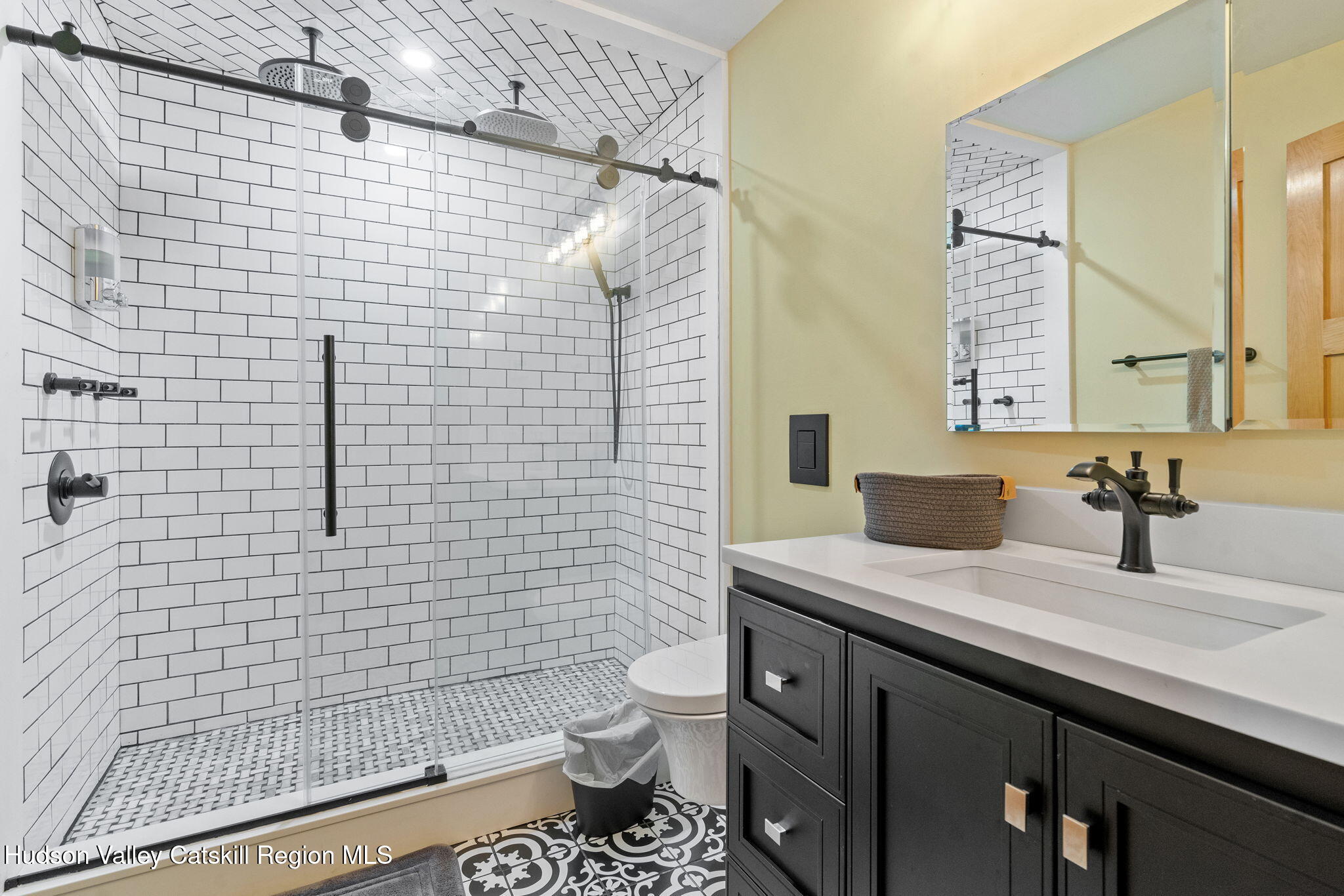35 Scribner Hollow Road, Unit E3 Hunter, NY 12442 - Photo 28 of 59 a bathroom with a granite countertop toilet sink and mirror
