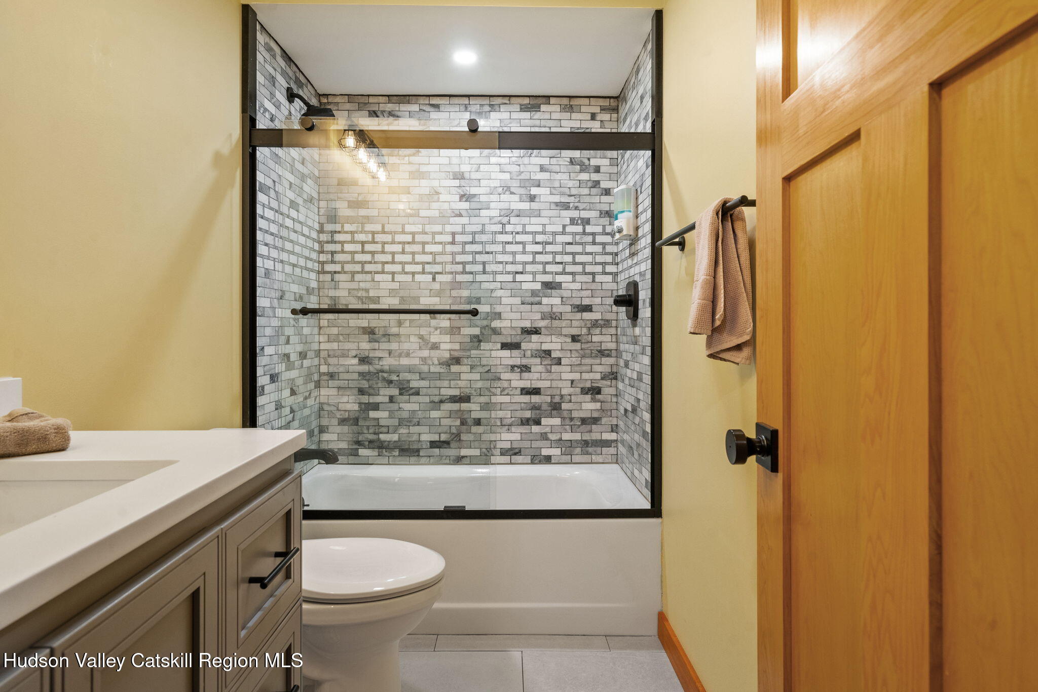 35 Scribner Hollow Road, Unit E3 Hunter, NY 12442 - Photo 31 of 59 a bathroom with a sink toilet and shower