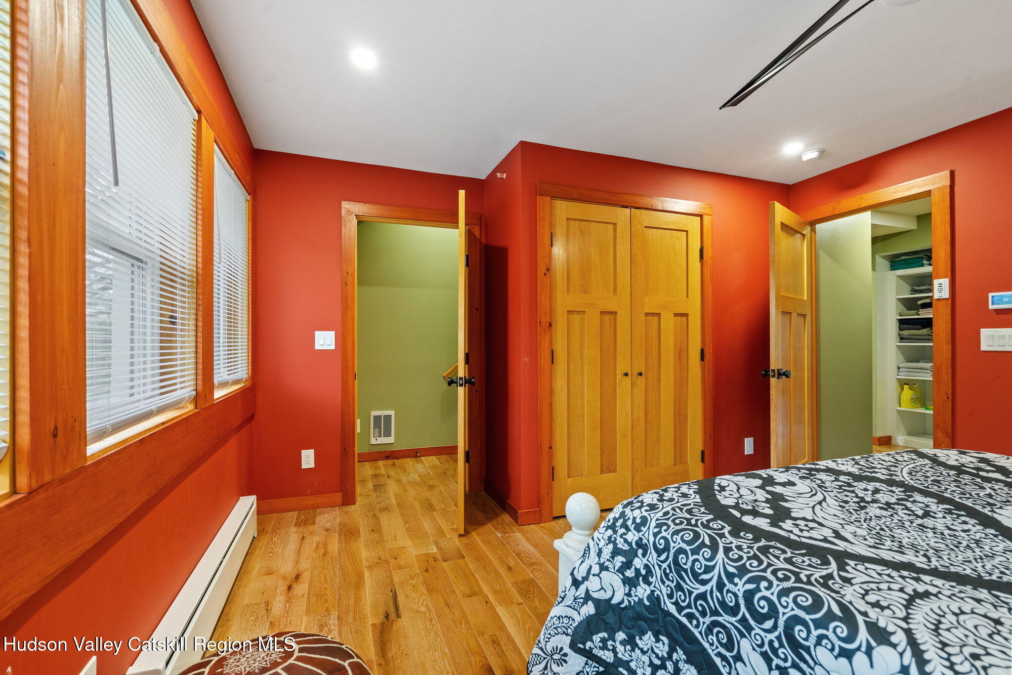 35 Scribner Hollow Road, Unit E3 Hunter, NY 12442 - Photo 35 of 59 a bedroom with a bed and a dresser next to a window